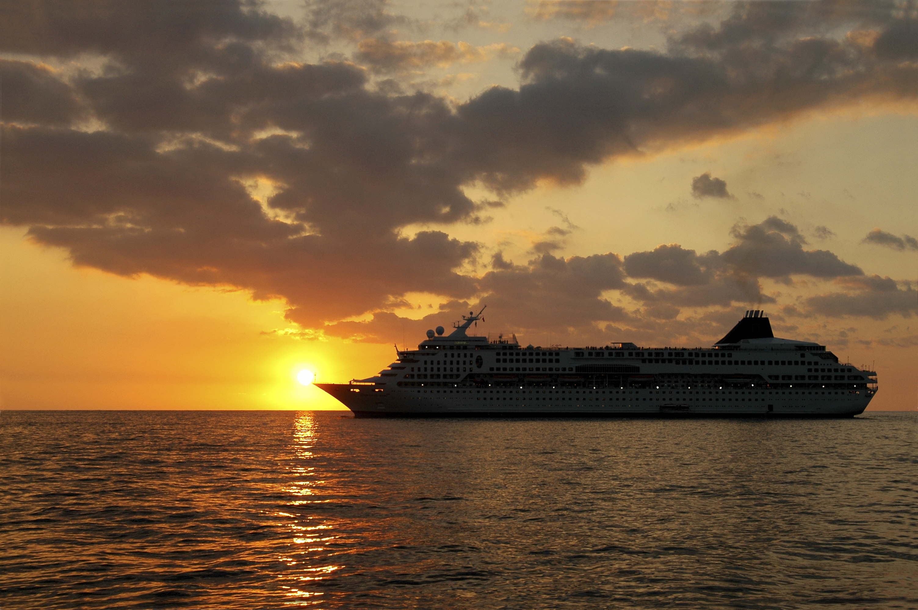 Passenger ship sunset sea