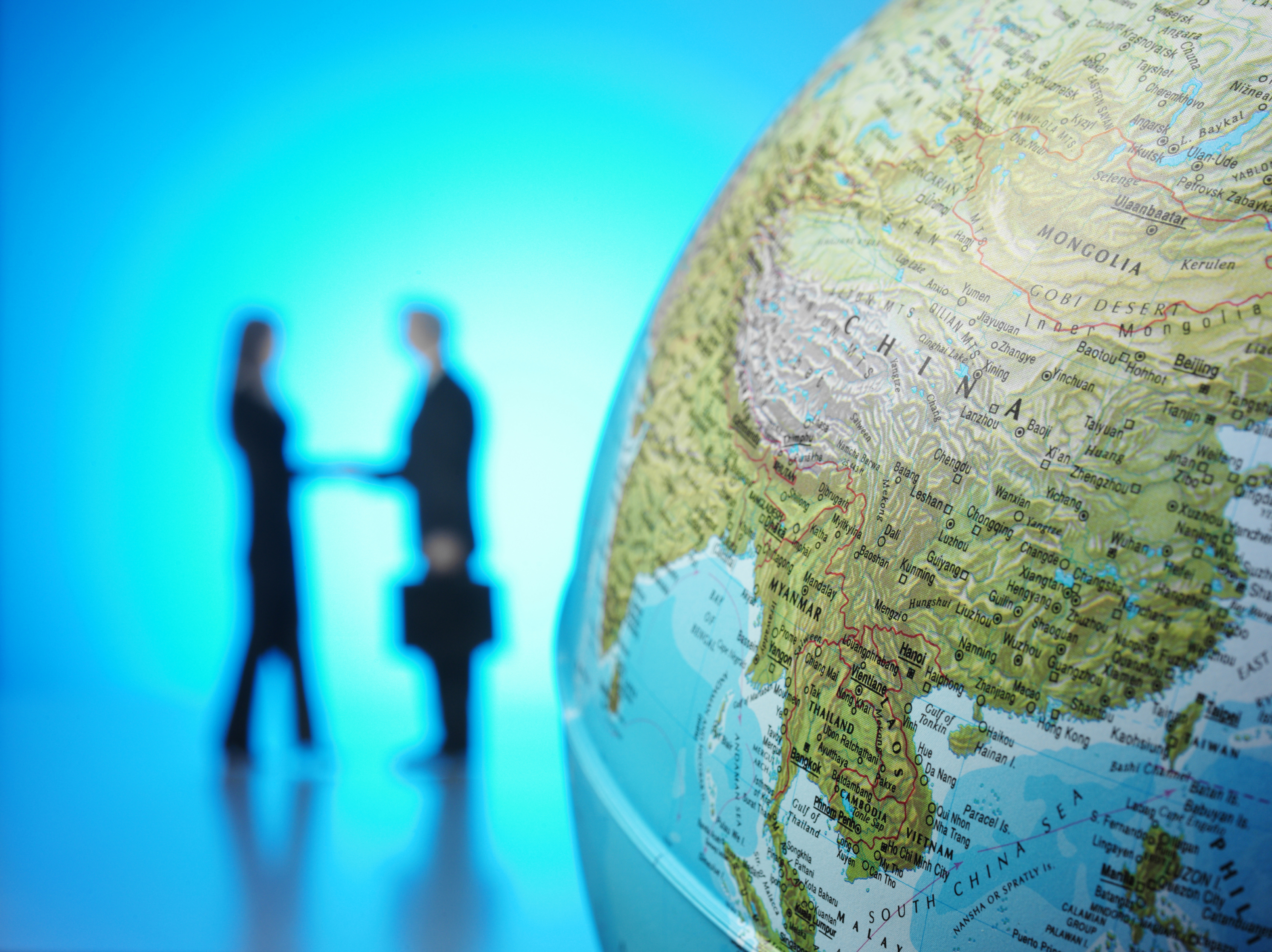 Business agreement globe China SE Asia